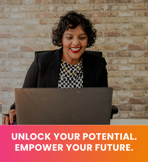 Smiling woman sitting and looking at laptop