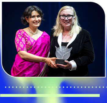 two women holding award